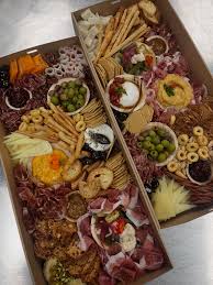 A Pig in a Fur Coat signature dishes House-Made Charcuterie Board, various handmade pastas, dishes featuring offal and less common cuts of meat, creative vegetable preparations. (Menu is seasonal).